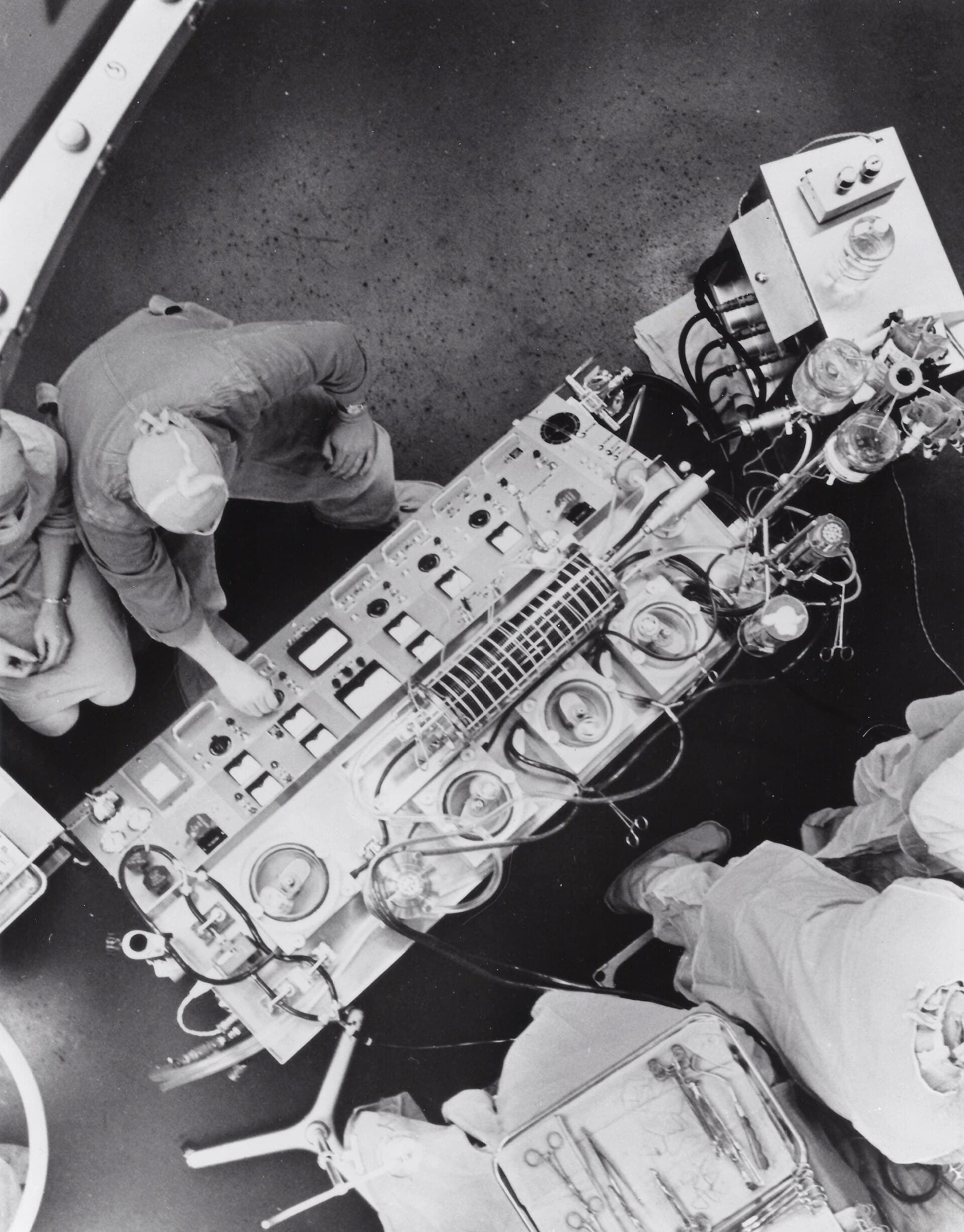 An empty hospital operating room with lights and equipment